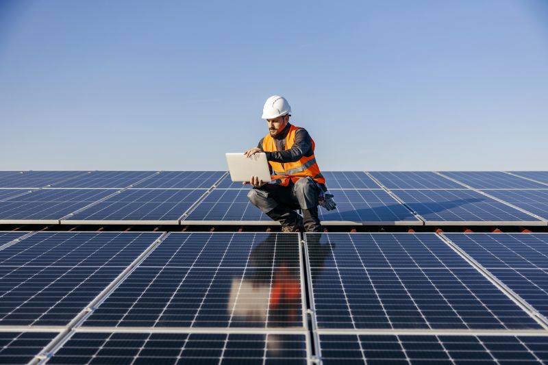 Solar technician performing system check